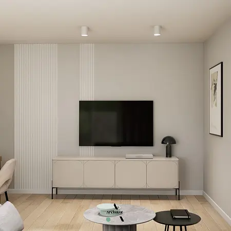 Wnętrze salonu z telewizorem, białą komodą i nowoczesną lampą.