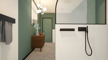 Łazienka w stylu art deco i vintage z zielonymi ścianami i czarnymi detalami.