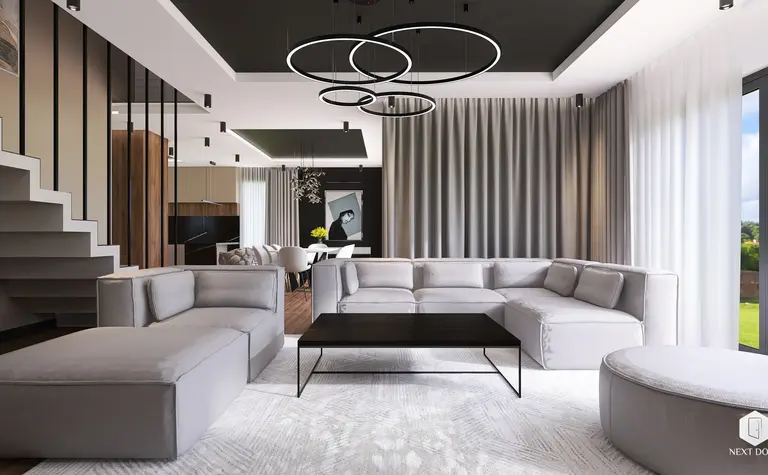 Wnętrze salonu z szarymi meblami i dużymi oknami, styl quiet luxury.