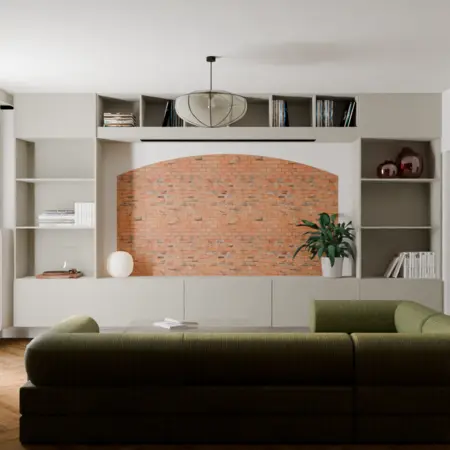 Wnętrze salonu z zieloną sofą, ceglaną ścianą i rośliną, styl vintage.