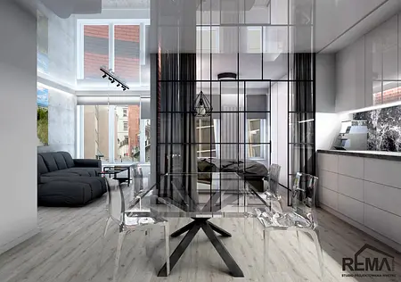 Wnętrze nowoczesne z industrialnymi akcentami, przezroczysty stół i czarna sofa.