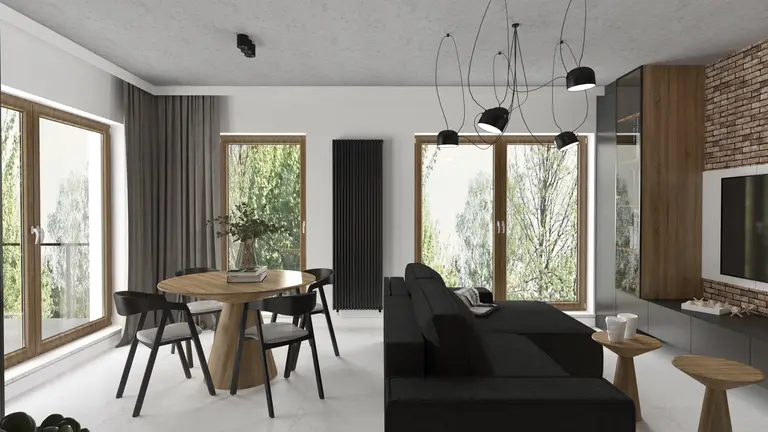 Wnętrze salonu w stylu industrialnym z czarną sofą, drewnianym stołem i dużymi oknami.