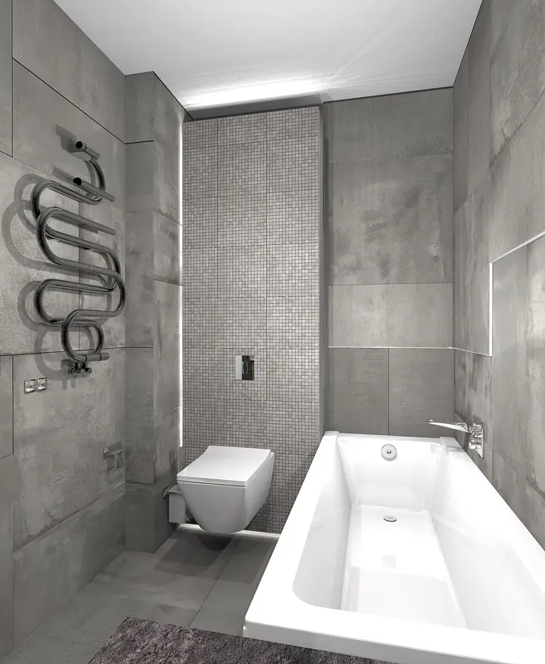 Nowoczesna łazienka w stylu industrialnym z minimalistycznym wystrojem, szarymi płytkami i białą wanną.