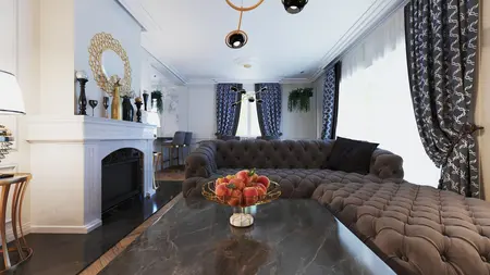 Wnętrze salonu w stylu glamour z szarym narożnikiem, złotymi detalami i eleganckimi zasłonami.