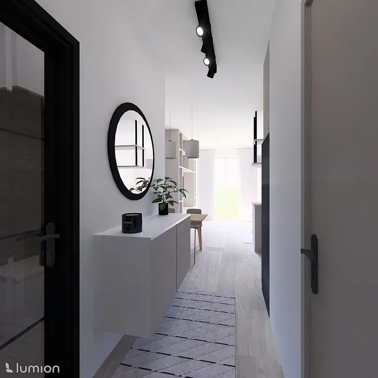 Przedpokój w stylu minimalistycznym z białymi meblami i czarnymi detalami.