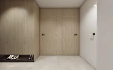 Przedpokój w stylu minimalistycznym z drewnianymi meblami i nowoczesnym oświetleniem.