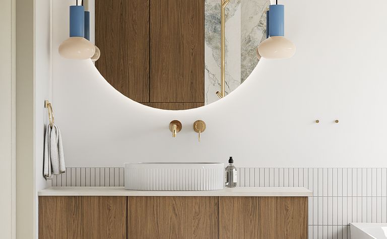 Nowoczesna łazienka w stylu art deco z drewnianą szafką i okrągłym lustrem.