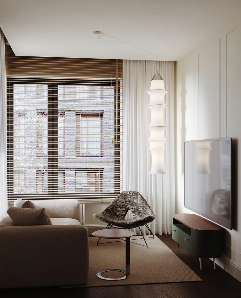 Wnętrze salonu w stylu nowoczesnym i soft minimalizm z jasnym dywanem oraz dużym telewizorem.