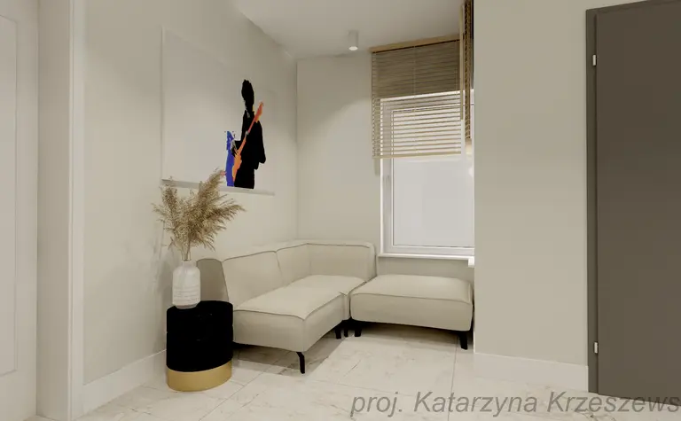 Wnętrze kącika wypoczynkowego z jasną sofą i obrazem, nowoczesny design.