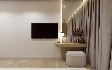 Wnętrze pokoju z telewizorem, jasnymi zasłonami i minimalistycznym biurkiem.