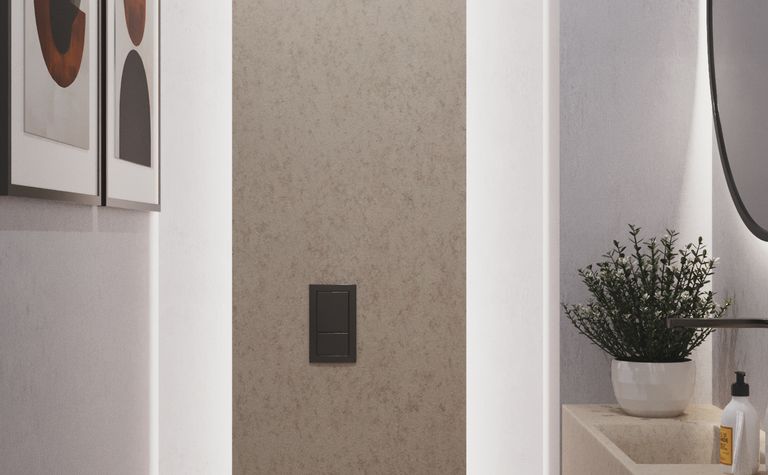 Minimalistyczna toaleta z podświetleniem, nowoczesnymi detalami i rośliną.