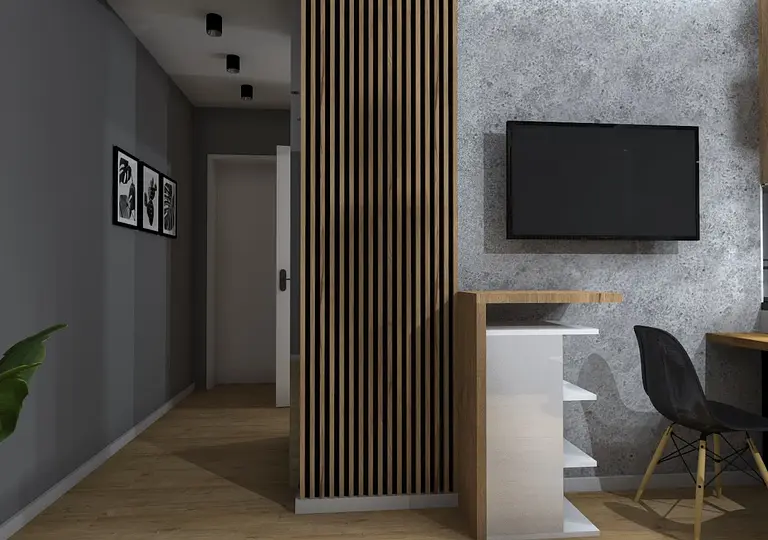 Wnętrze biura w stylu industrialnym z drewnianymi elementami i szarymi ścianami.