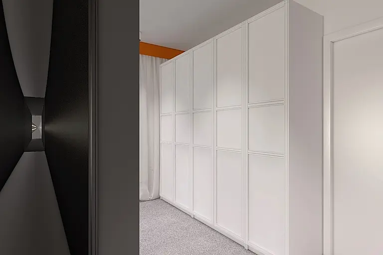 Garderoba w stylu minimalistycznym i skandynawskim z białymi meblami.