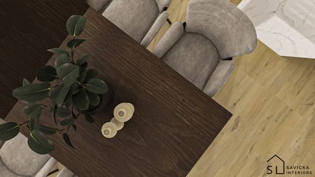 Wnętrze jadalni z drewnianym stołem, szarymi krzesłami i rośliną w doniczce. Minimalistyczny design.